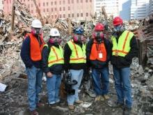 Paul Luke, FEMA Broadcast Operations Manager who was a videographer for the response and recovery efforts following the 9/11 attacks, with four other men at the Ground Zero site.