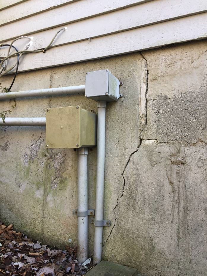 A crack in a home’s foundation caused by pyrrhotite in the concrete.