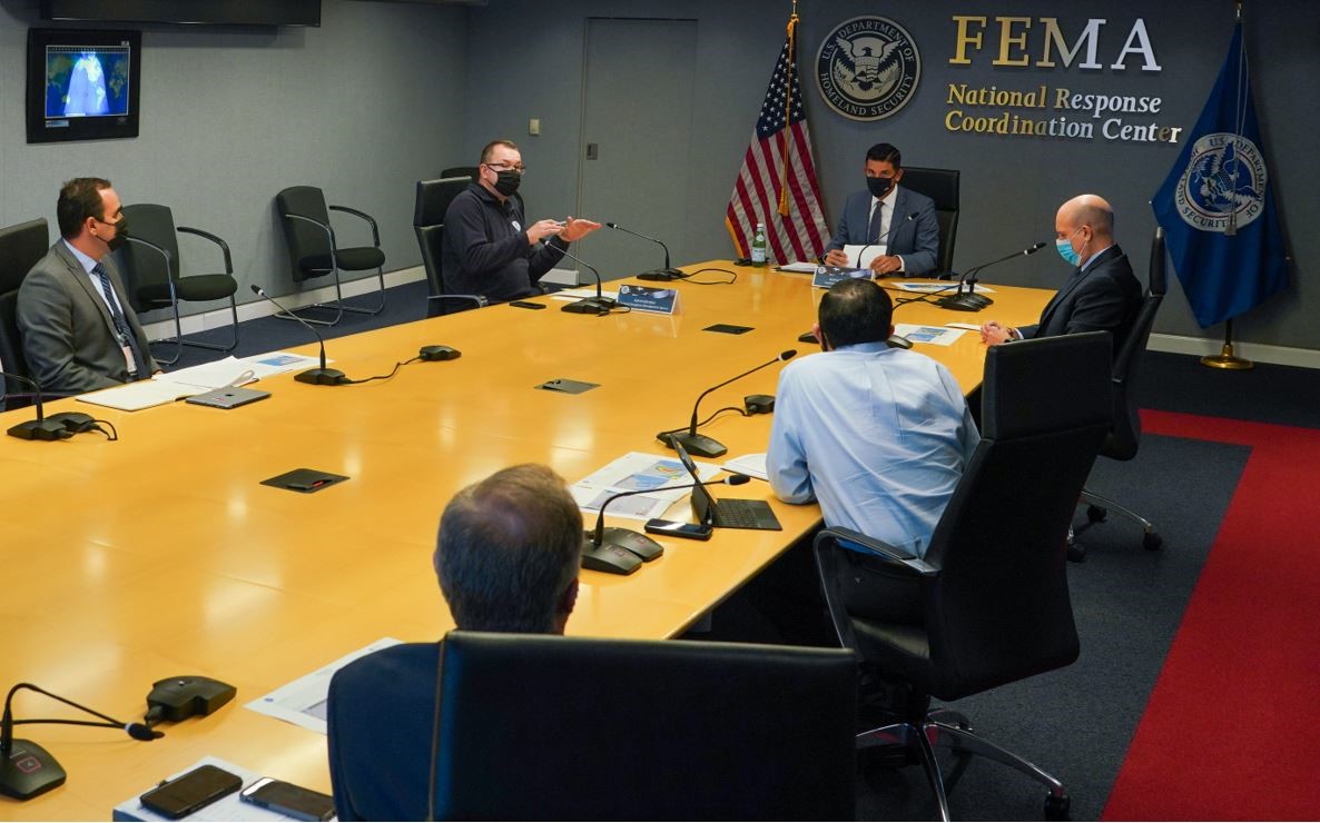 Department of Homeland Security Acting Secretary Chad Wolf (head of table) receives a  Hurricane Delta update from FEMA Administrator Pete Gaynor (farside center) and other agency leaders.   
