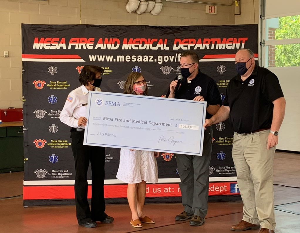 FEMA Administrator Pete Gaynor (2nd from right) presents the Mesa Fire and Medical Department with a check representing the awarding of an Assistance to Firefighter Grant that will help provide critical resources and training for the department. 
