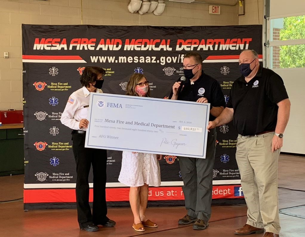 FEMA Administrator Pete Gaynor (2nd from right) presents the Mesa Fire and Medical Department with a check representing the awarding of an Assistance to Firefighter Grant that will help provide critical resources and training for the department.