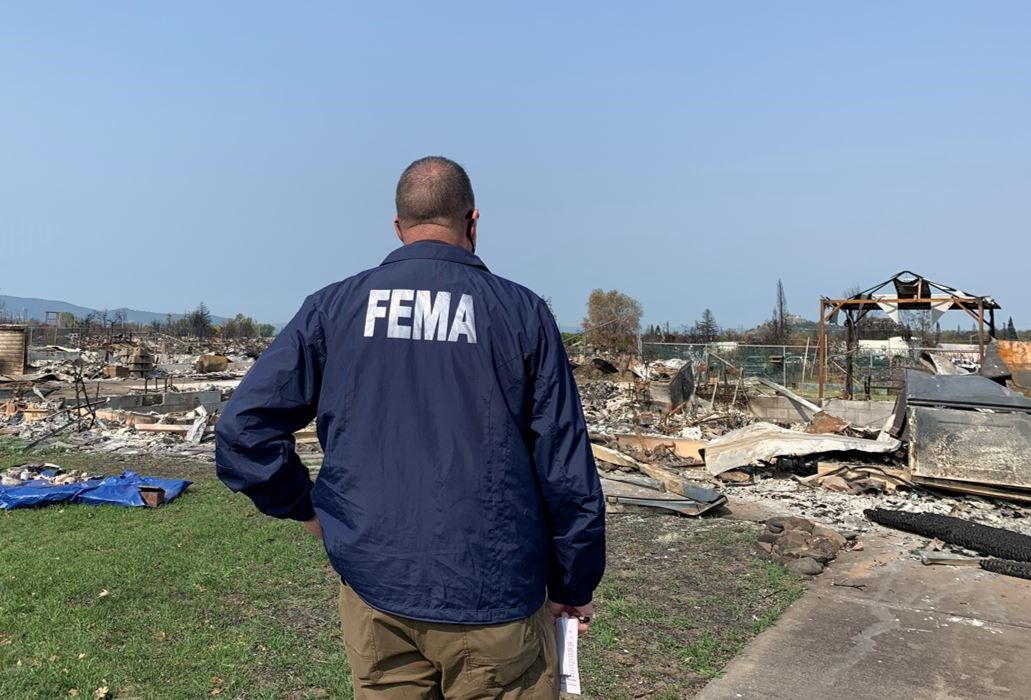 FEMA Administrator Pete Gaynor surveys a fire-damaged area in Oregon. The administrator met with community, local and state leaders to discuss the ongoing response to wildfires in the state.