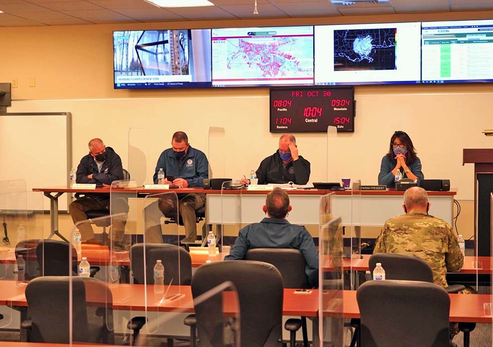 FEMA Administrator Pete Gaynor (far row, 2nd from left), FEMA Region 6 Regional Administrator Tony Robinson (far left) and Jefferson Parish President Cynthia Lee Sheng listen to an update on the impacts of Hurricane Zeta at the Jefferson Parish Department of Emergency Management operations center.