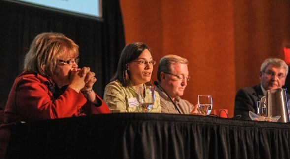 Panelists speaking to community leaders at the Symposium. Left to right: Jane Cage, Rebecca Ellis, Kelly Arnold, and Bob Dixson.