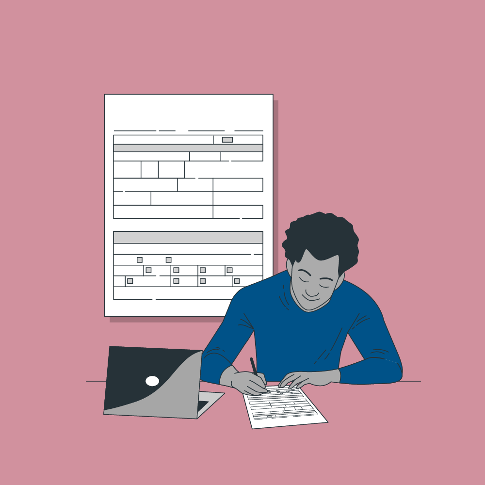 Man at desk filling out a paper form