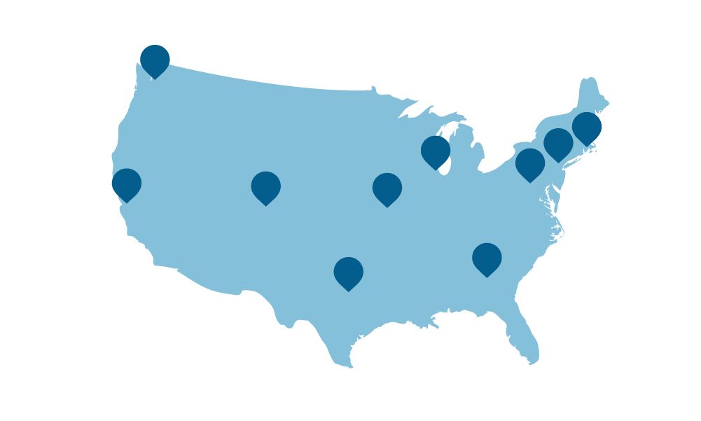 A light blue map with dark blue pins on it