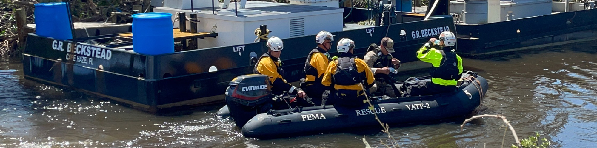 FEMA personnel are in a boat doing rescue operations