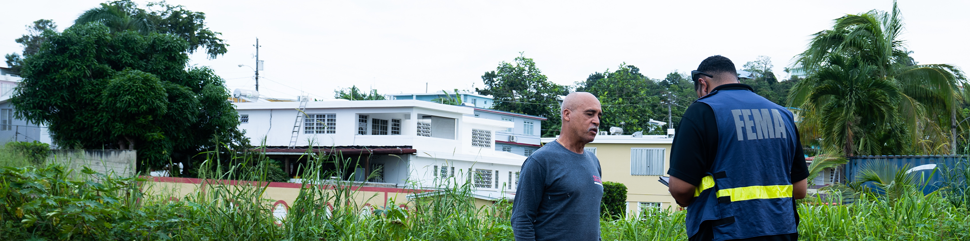 A FEMA employee assists a disaster survivor
