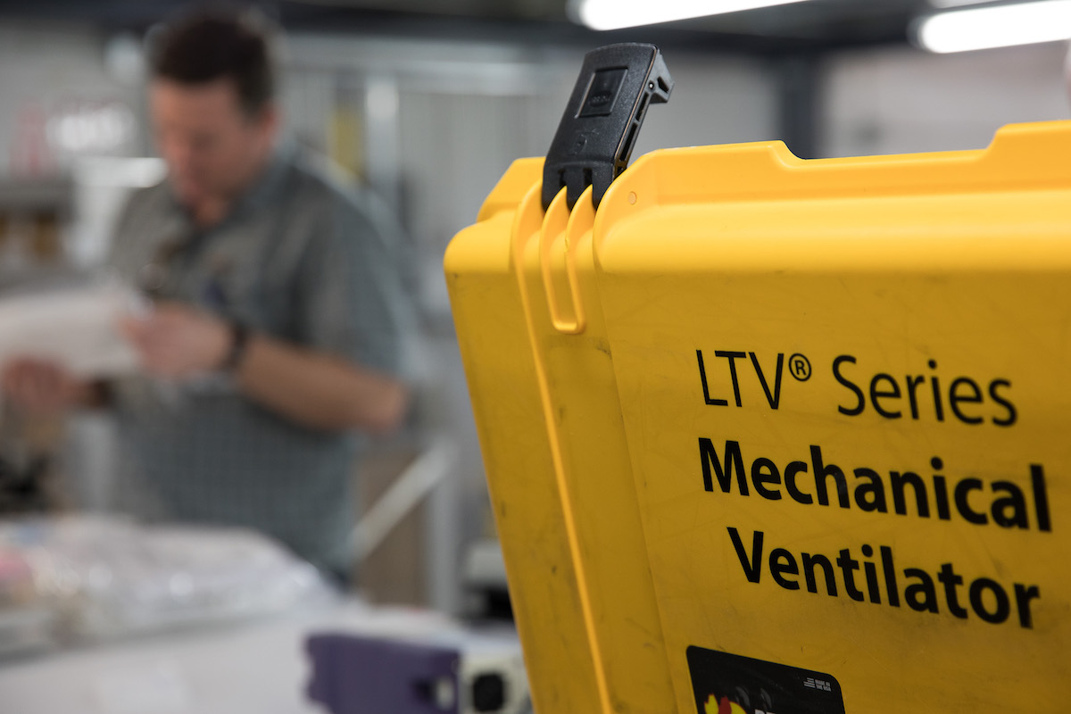 Close-up of a mechanical ventilator contained in a yellow box