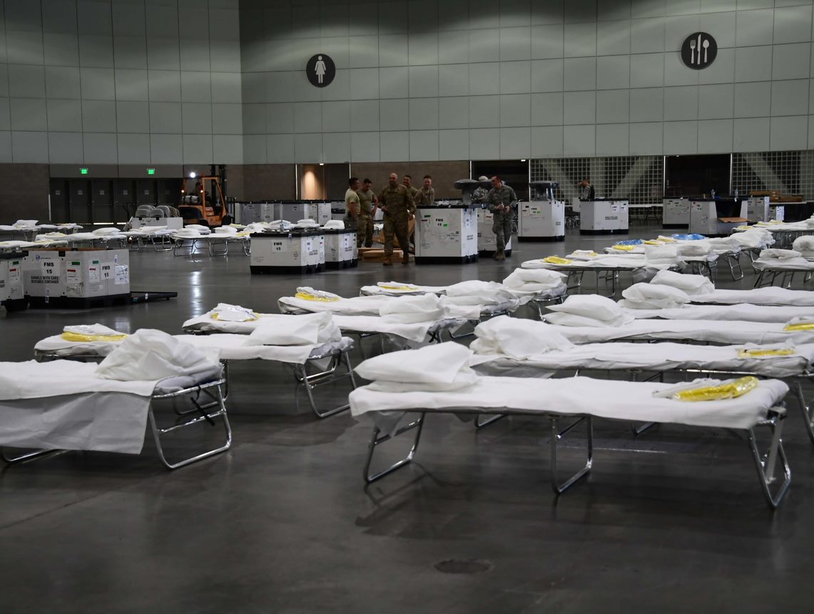 19-plus cots in a large open space.