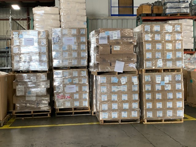 Stacks of boxes including N-95 masks arrive in Hawaii.