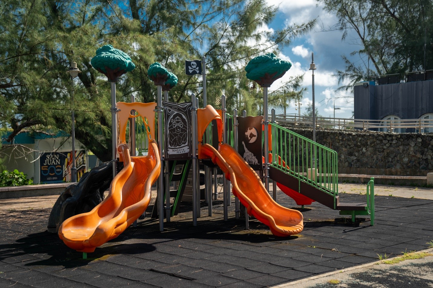 Bright colored playground with two orange slides
