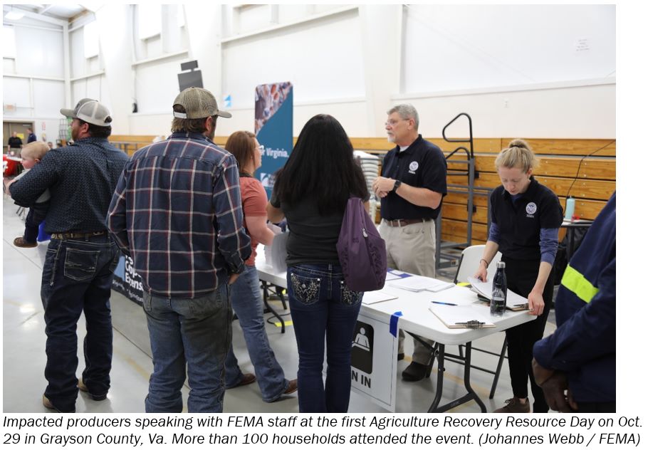 Impacted producers speaking with FEMA staff at the first Agriculture Recovery Resource Day on Oct. 29 in Grayson County, Va. More than 100 households attended the event. (Johannes Webb/FEMA)