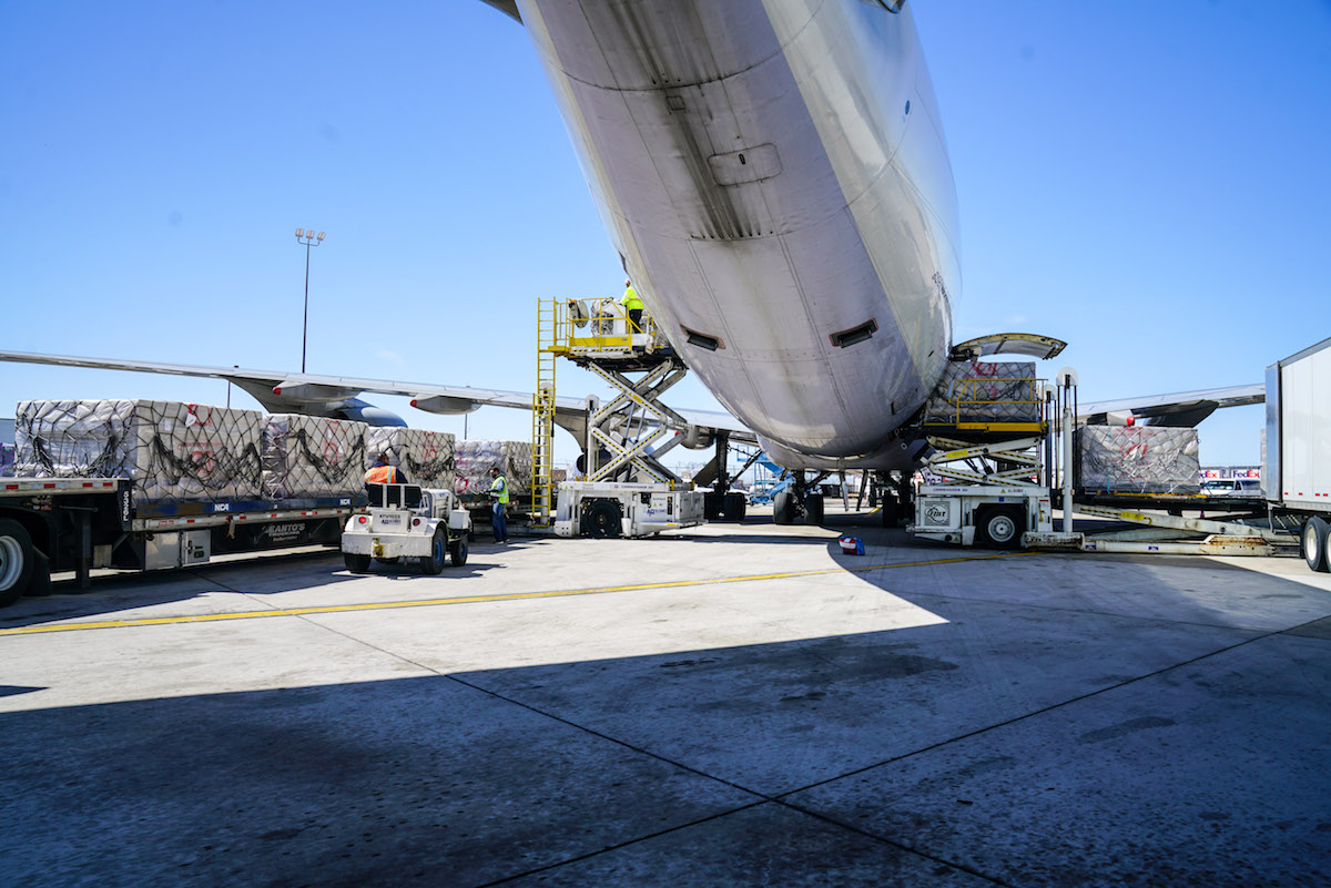 Supplies being delivered from a plane at an airport