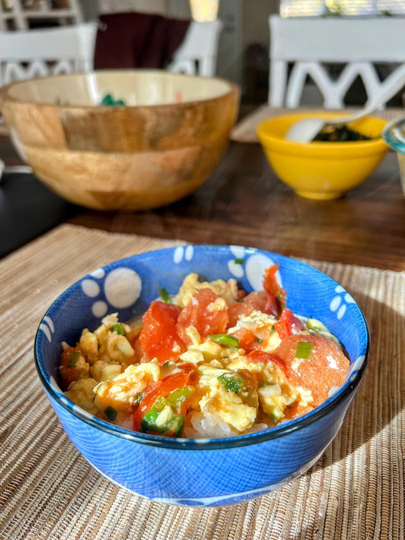 Tomato Egg Stir Fry in a blue bowl
