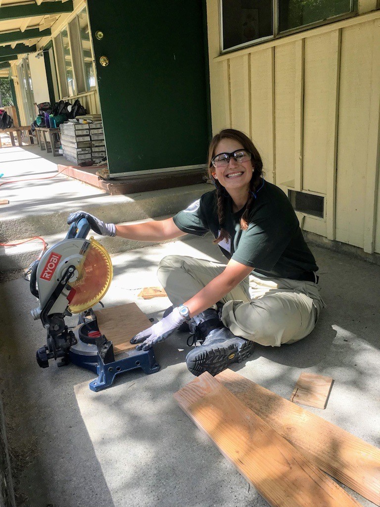 AmeriCorps member performing community service during their service term.