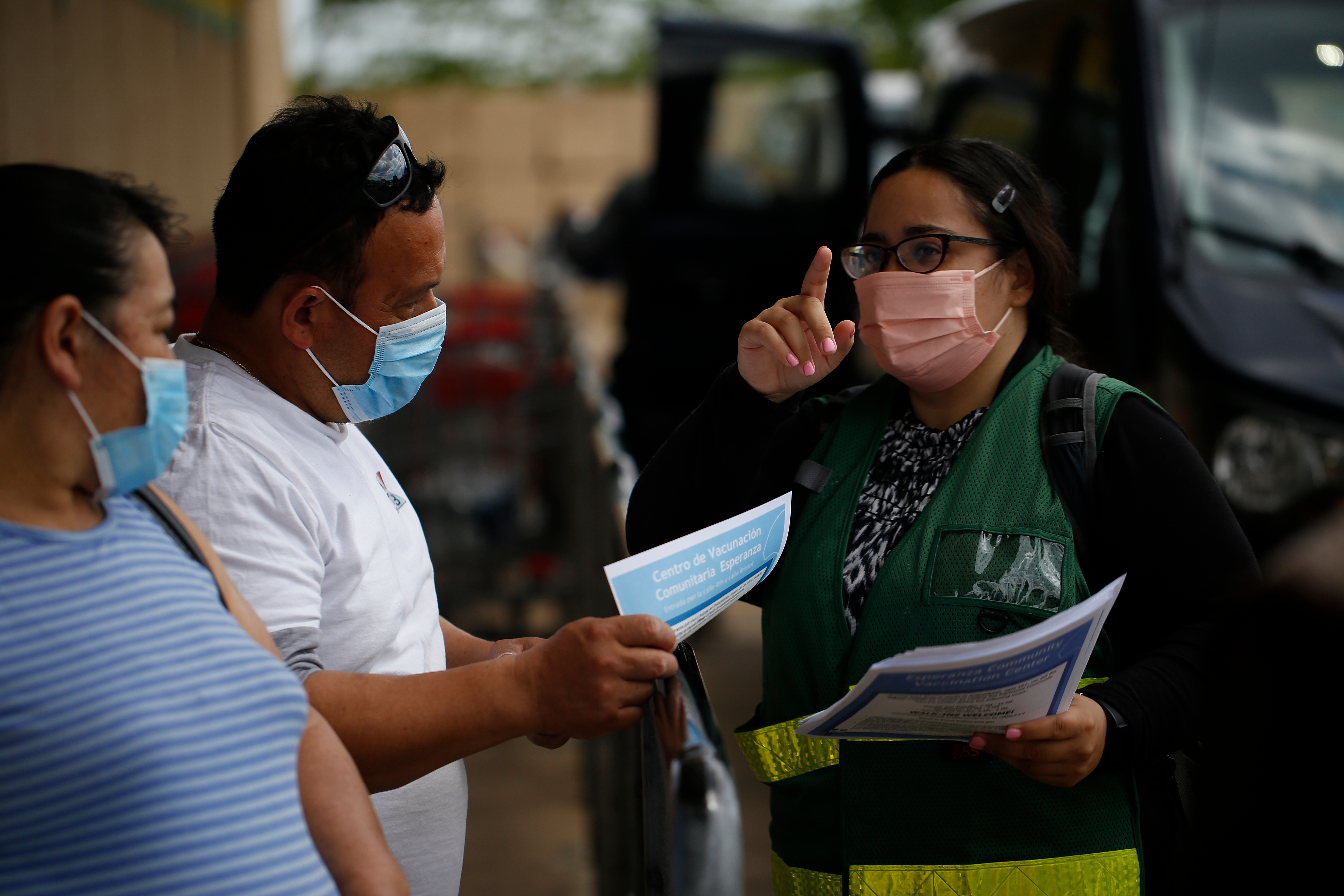 A Philadelphia Department of Public Health outreach team member canvasses a few blocks away from the Esperanza CVC in May 2021