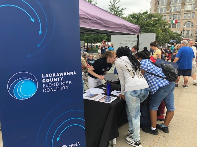 The Lackawanna County Flood Risk Coalition discusses local flood risks with members of the community at a local event in Lackawanna County, PA.