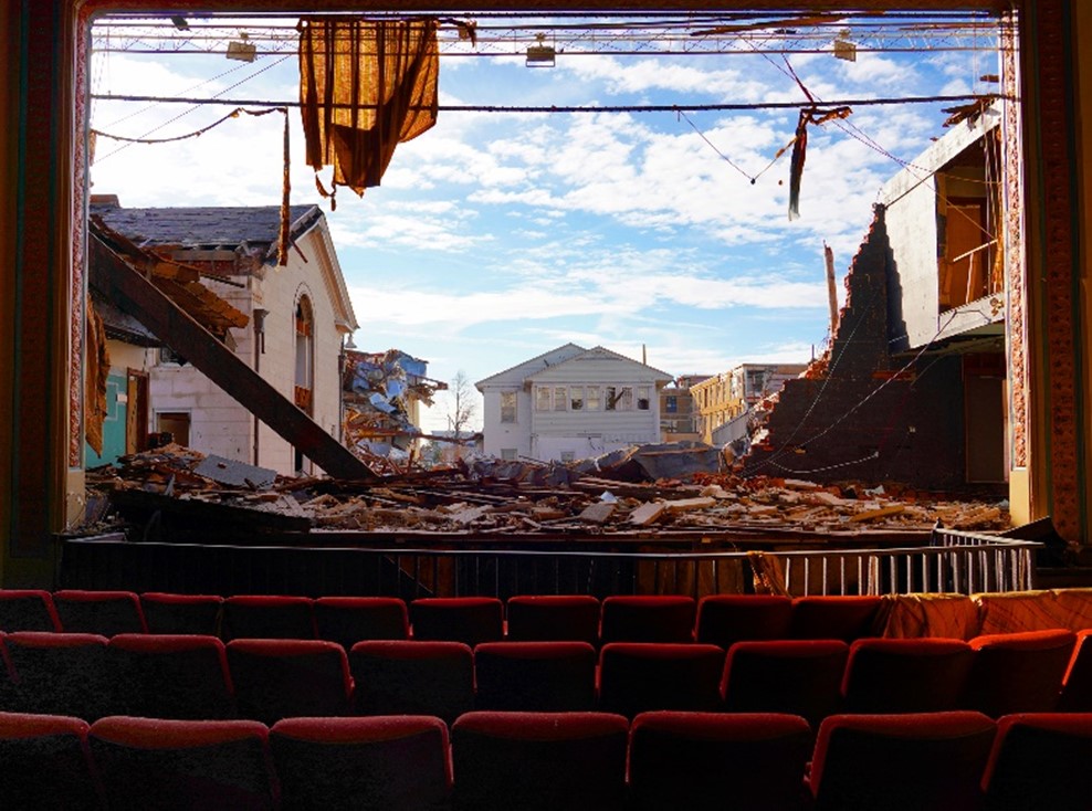 Movie theather with damage from Mayvield on the screen.