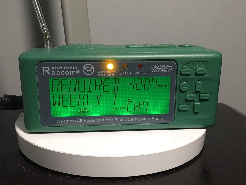 A green NOAA Weather Radio