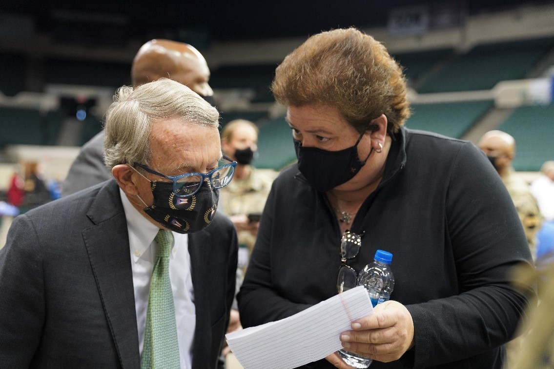 Ohio Governor Mike DeWine discusses the Cleveland community vaccination site opening with Ohio Emergency Management Agency Executive Director Sima Merick.