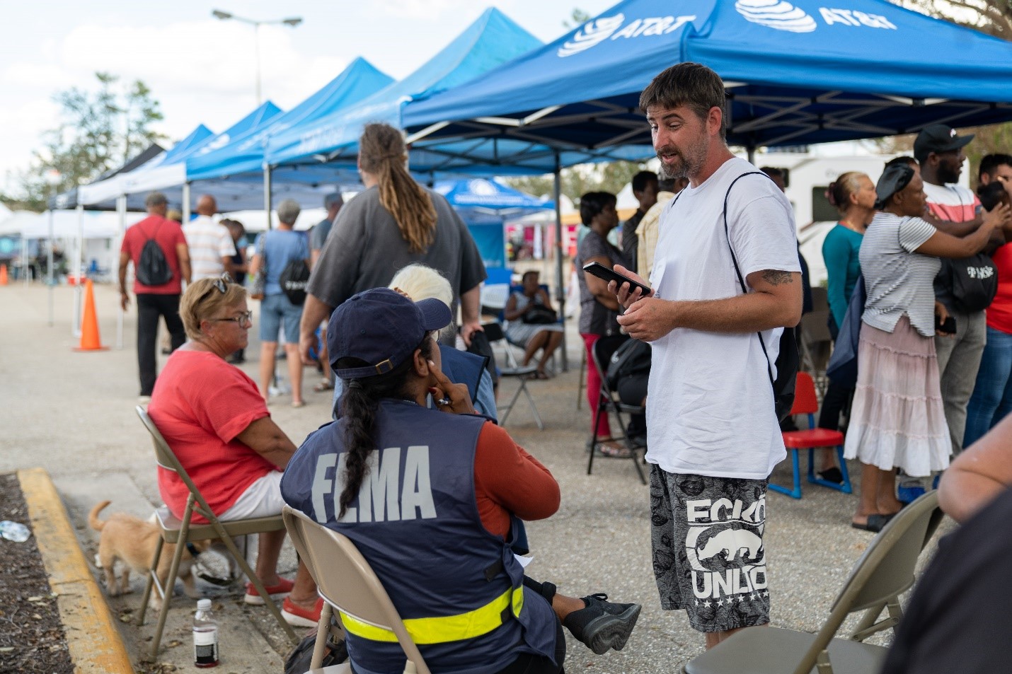 FEMA Personnel Speaks with Survivor About Recovery Assistance 