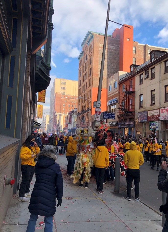 Crowds gather to watch a lion dance parade as part of Philadelphia’s Lunar New Year celebrations.