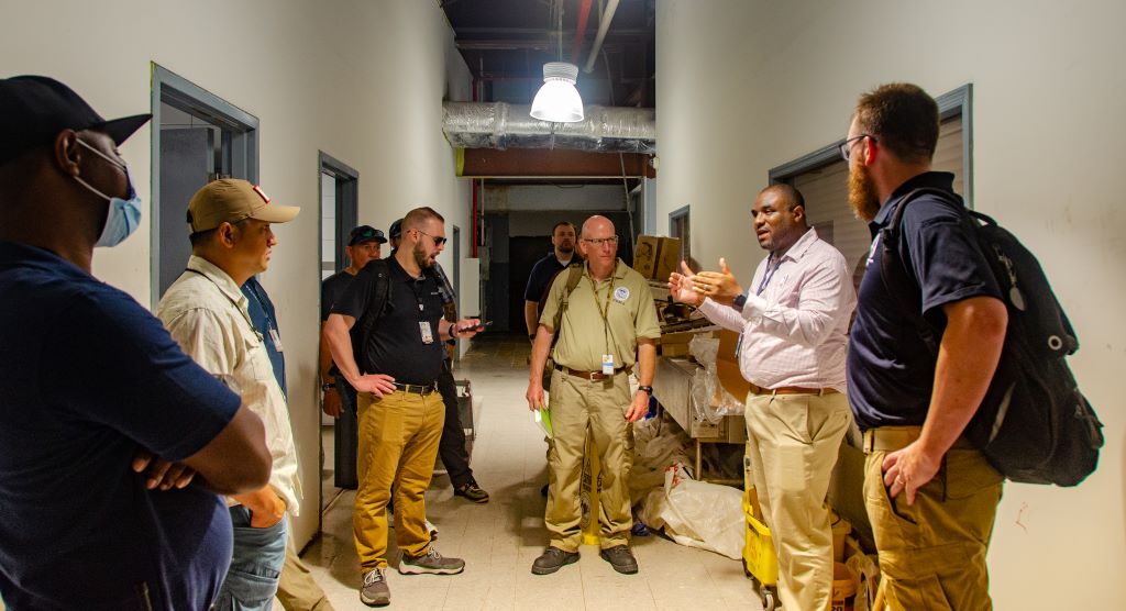 Territorial Airport Manager Jerome Sheridan, of the V.I. Port Authority, (right) leads federal air operations and FEMA logistics on a walk-through of Cyril E. King Airport in Lindbergh Bay during a hurricane response exercise. 