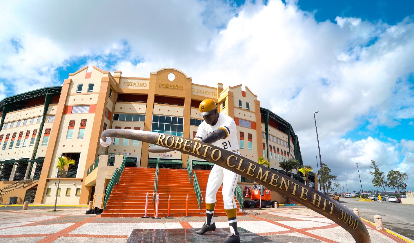 Front entrance of the Roberto Clemente Stadium. In front is a statue of Roberto Clemente.