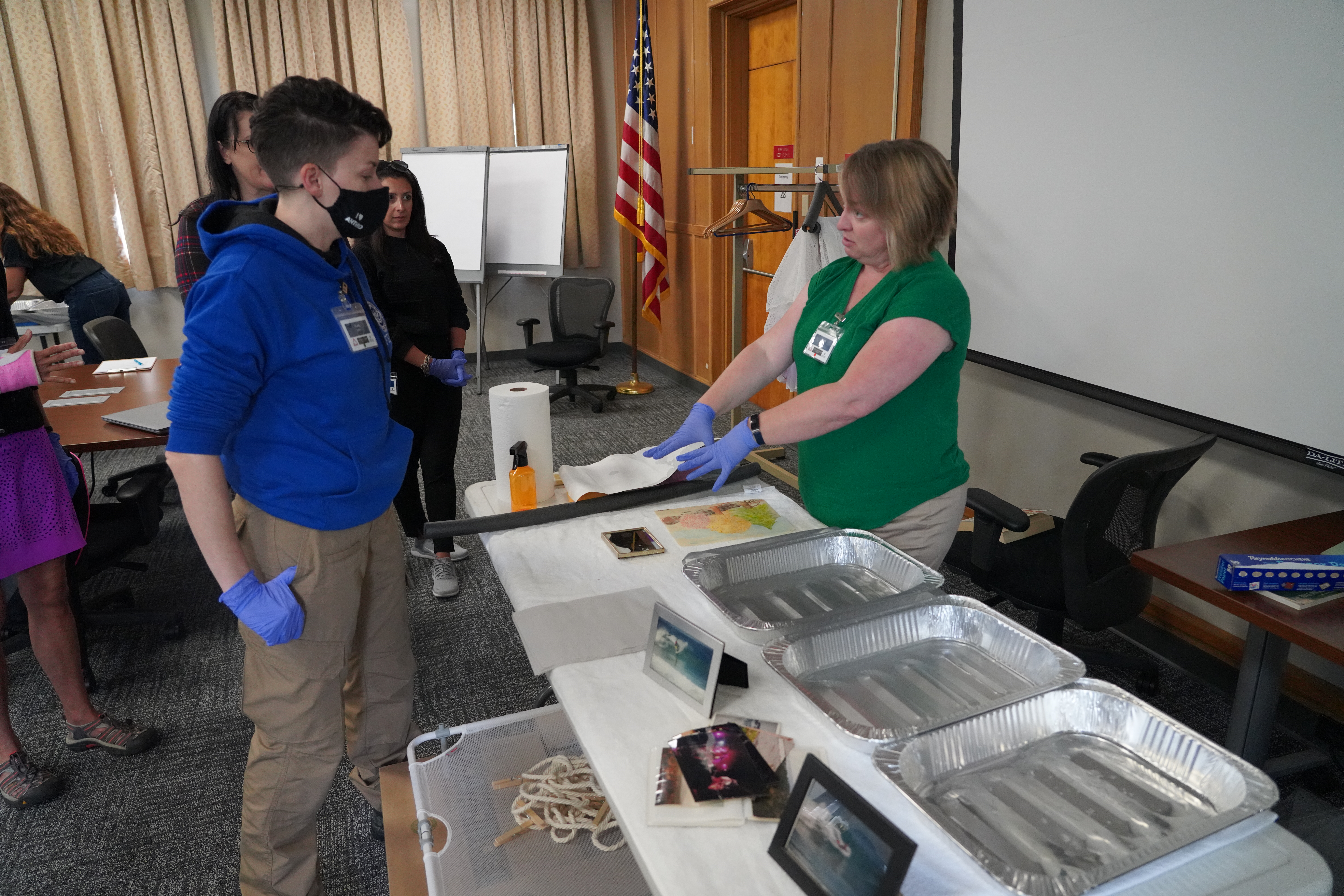 Students learn how to teach disaster survivors how to save their family treasures.