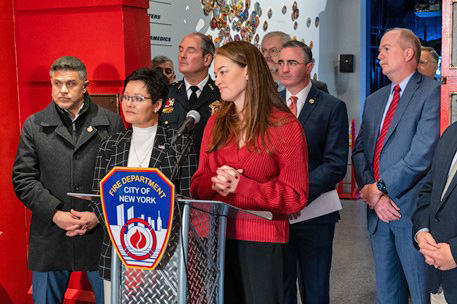U.S. Fire Administrator Dr. Lori Moore-Merrell (center left) stands alongside NYC Fire Commissioner Laura Kavanaugh (center) and other national and local leaders to honor those lost in the Twin Parks Fire.