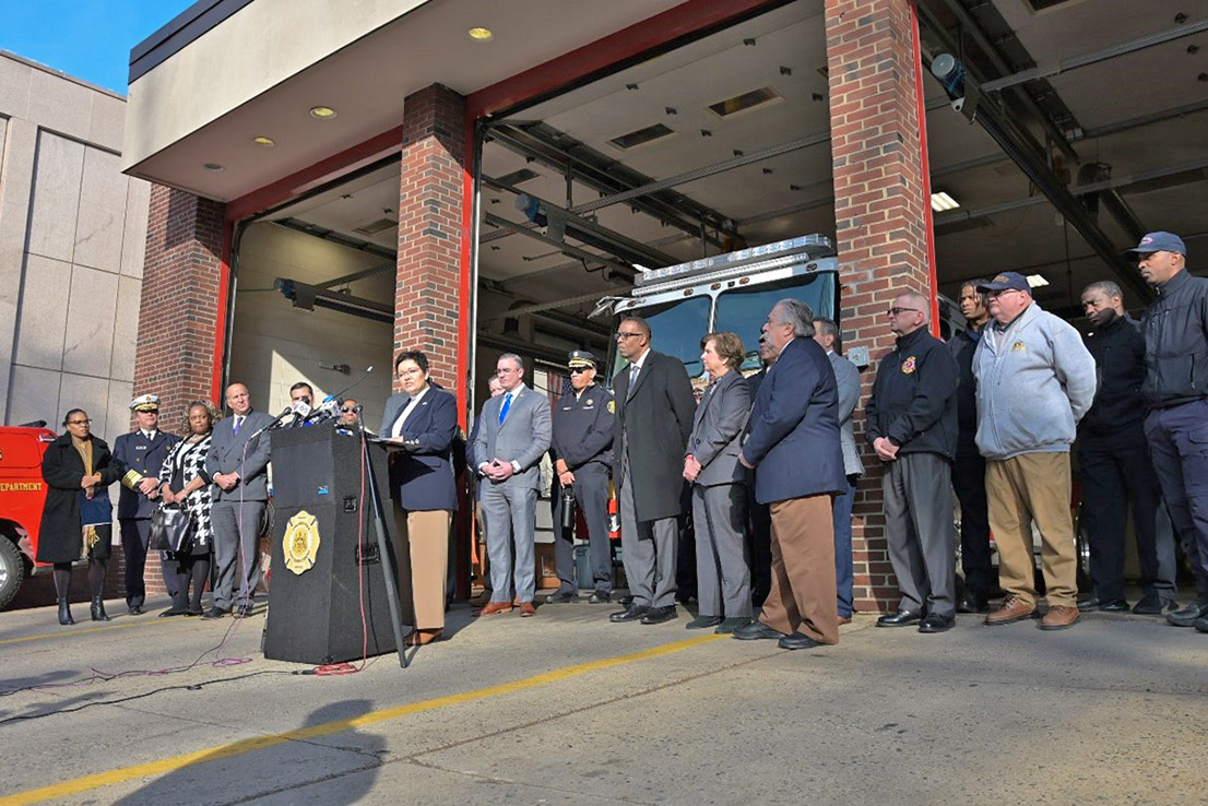U.S. Fire Administrator Dr. Lori Moore-Merrell speaks outside of a Philadelphia Fire Department, honoring those lost to the Fairmount Fire last year