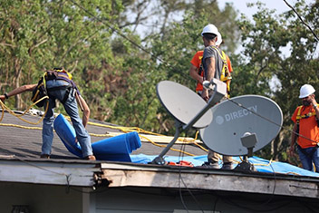 Delivering relief and hope to survivors, contractors work throughout the day to install temporary roofs on homes damaged by Hurricane Ida. 