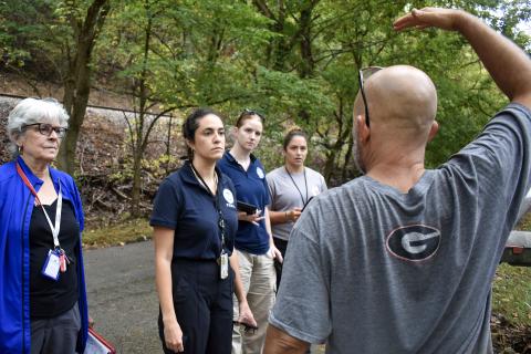 Caption: Montgomery County, Va. (Oct. 1, 2024) - A resident describes high water from the New River to a Preliminary Damage Assessment team days after it flooded its banks and into his home. The team, comprised of Montgomery County emergency managers, Virginia Department of Emergency Management, the U.S. Small Business Administration, and FEMA was reviewing Montgomery County properties impacted by Tropical Storm Helene.