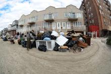  Rockaway, New York residents clean up after the impact of Hurricane Sandy. 
