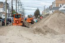  Local crews clear streets that are piled with sand due to the impacts of Hurricane Sandy. 