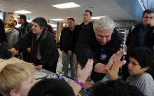  DHS officials visit a shelter 