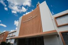 White and brown two-story building entrance.