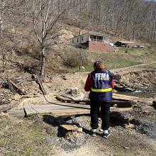 FEMA staff survey damages in Raysal, WV. (FEMA)