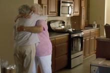 Then-Rainelle Mayor Andrea Pendleton, left, congratulates Juanita Ruzek upon the 2017 dedication of her home, which had been flooded in 2016.