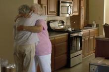 Then-Rainelle Mayor Andrea Pendleton, left, congratulates Juanita Ruzek upon the 2017 dedication of her home, which had been flooded in 2016. 