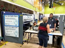 A women checking into a Disaster Recovery Center