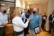 FEMA Administrator Deanne Criswell (left) greets Louisiana Gov. John Bel Edwards.