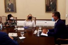 FEMA Administrator Deanne Criswell (center) discusses ongoing recovery and hurricane preparedness efforts with Puerto Rico Gov. Pedro Pierluisi (right).